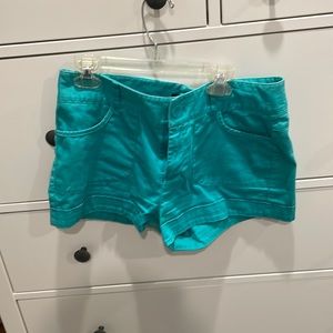 Teal/turquoise shorts. Mid-high rise. Medium